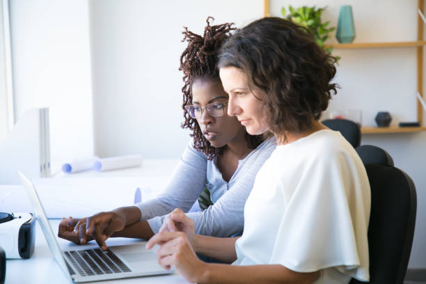 istock Female colleagues watching presentation 1178531434