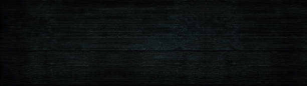 Black wood wide panoramic texture. Wooden backdrop horizontal panorama. Dark timbers surface background