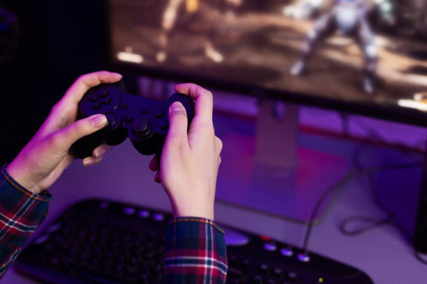 istock Gamer playing video game, holding joystick, free space 1178532885