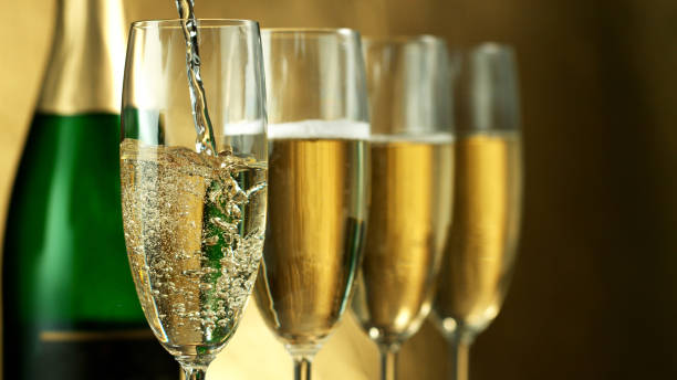 istock Pouring champagne wine into goblet 1178532934
