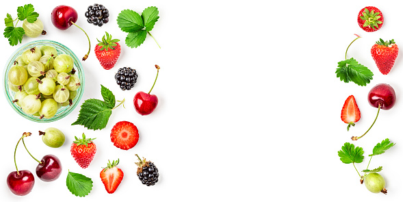 Fresh strawberry, cherry, gooseberry and blackberry frame isolated on white background. Healthy eating concept. Summer fruits arrangement. Top view, flat lay, design elements banner collection