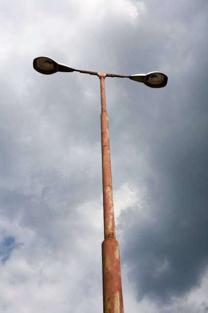 istock weathered old streetlamps against cloudy sky 1178533042