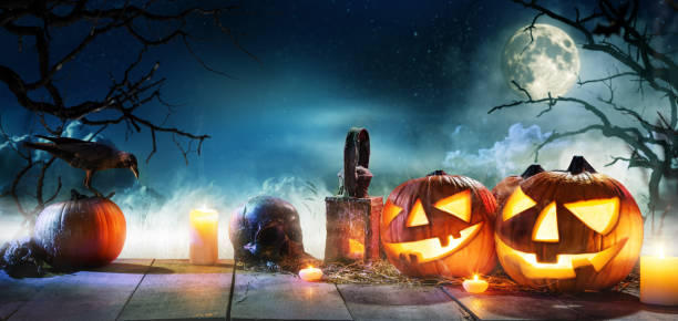 istock Scary horror background with halloween pumpkins jack o lantern 1178533176