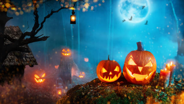 istock Spooky halloween pumpkins in dark mistery forest 1178533285