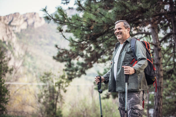 istock An older man is hiking 1178533296