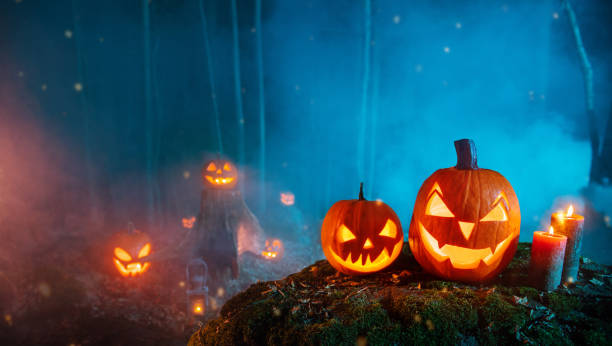 istock Spooky halloween pumpkins in forest 1178533360