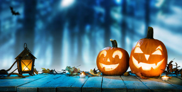 istock Spooky halloween pumpkins in forest 1178533407
