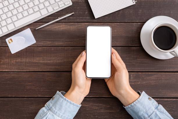 istock Female hands holding smartphone with blank screen for advertisement. 1178534644