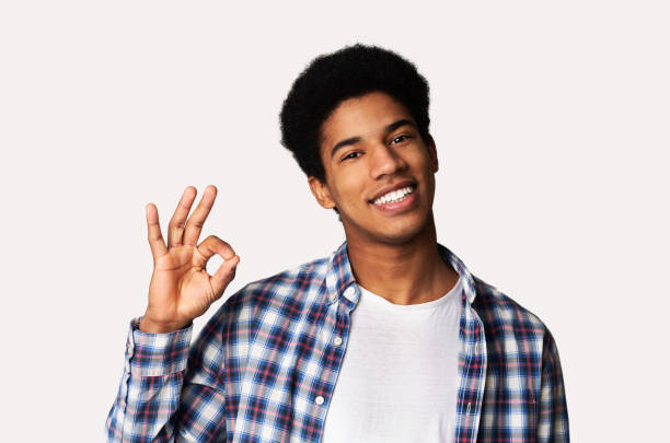 istock Happy african guy gesturing OK sign and smiling 1178534681