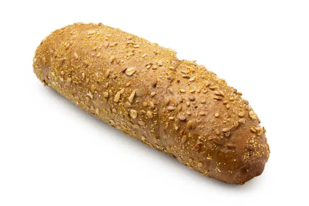 Long whole wheat bread roll with sesame seeds isolated on white.
