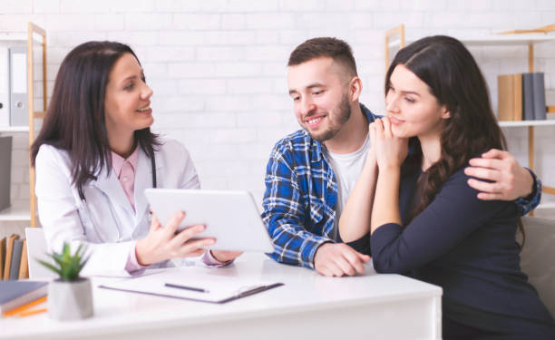 istock Happy young spouses enjoying ultrasound video on digital tablet 1178535163