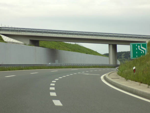 istock Overpass on the highway, and a concrete retaining wall 1178535222