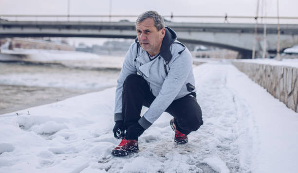 istock An older man jogs in the winter 1178535922