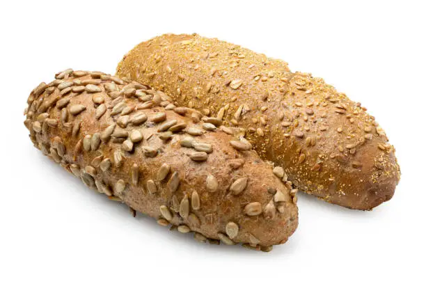 Long whole wheat sunflower seed bread roll and long whole wheat sesame seed bread roll isolated on white.