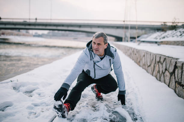 istock An older man jogs in the winter 1178535996