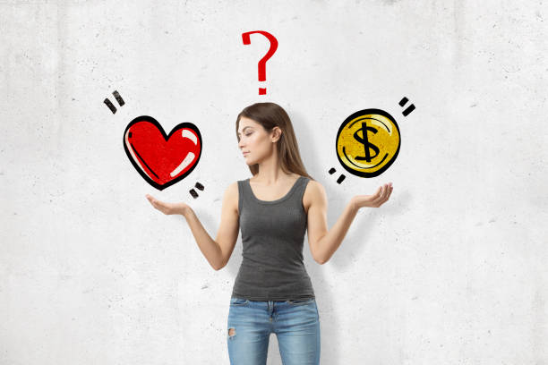 young woman in sleeveless top, elbows bent, palms facing up to catch heart and coin drawn on wall behind, with question mark above head. - aspirations choice choosing women imagens e fotografias de stock