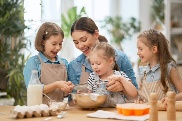 istock family are preparing bakery together 1178536628