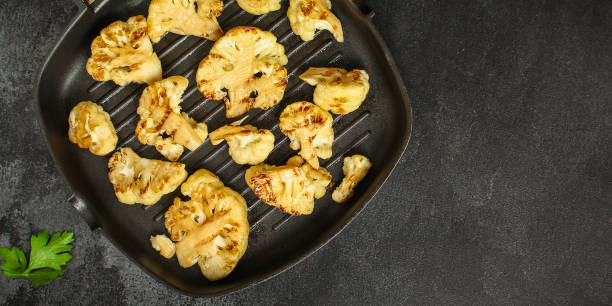 istock cauliflower grilled (fried grill vegetables or snack salad, bruschetta with tomato) menu concept. food background. copy space. Top view 1178537556