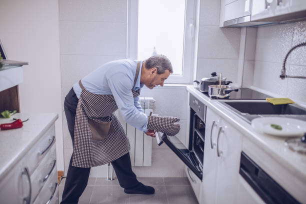 istock An old chef prepares a vegetarian lunch in a white kitchen 1178538653