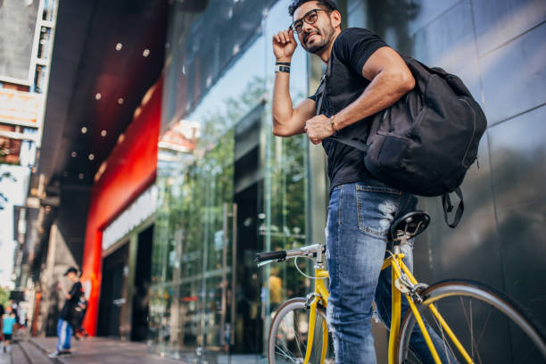 istock Handsome guy riding bicycle in city 1178540655