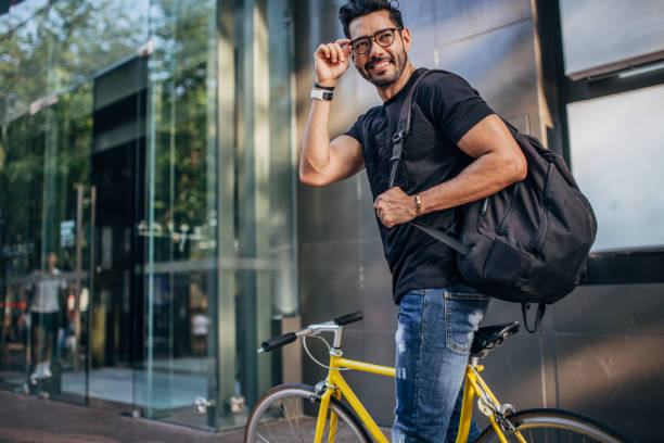 istock Modern man riding bicycle in city 1178540737