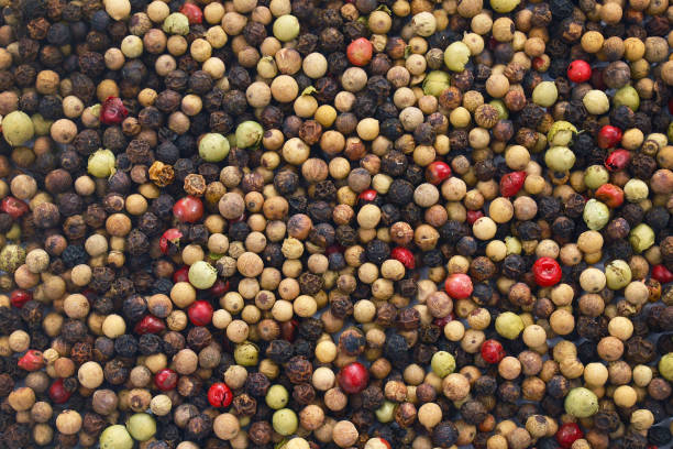 istock Top view background with whole red, white, green and black colored pepper corns 1178543069