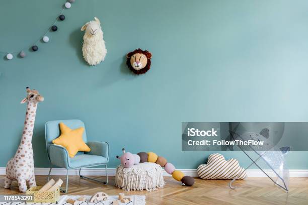 Stylish Scandinavian Kid Room With Toys Teddy Bear Plush Animal Toys Mint Armchair Umbrella Cotton Balls Modern Interior With Eucalyptus Background Walls Design Interior Of Childroom Template Stock Photo - Download Image Now