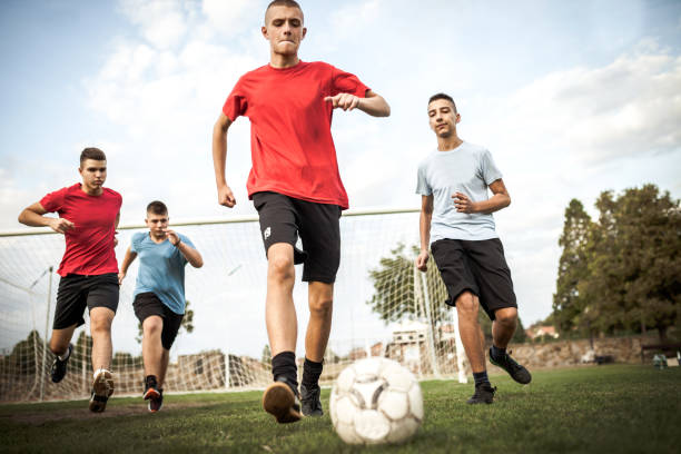 Teenage friends soccer team Teenage friends soccer team club soccer photos stock pictures, royalty-free photos & images