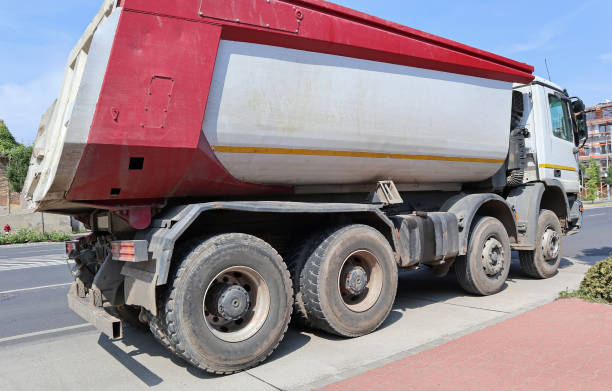 istock Large truck on the road near a construction site 1178544504