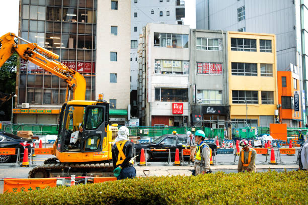 Tokyo, Japan - August 8, 2019: Men at work in the street of Nishi-Shinjuku, Tokyo, Japan