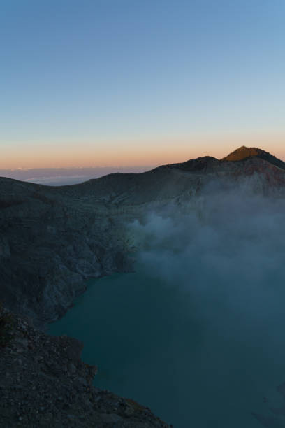 istock First light with fog. Sunrise on on the mountain  Ijen  Java ,Indonesia. 1178544774