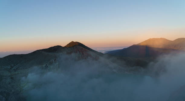 istock First light with fog. Sunrise on on the mountain  Ijen  Java ,Indonesia. 1178544847