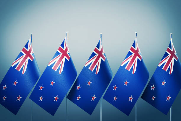 istock New Zealand Flags in A Row on Grey Background 1178544873