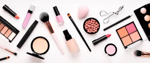 Photo of Set of cosmetic products for makeup with natural brushes