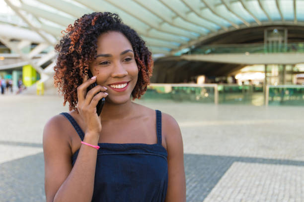 istock Happy woman enjoying phone talk outside 1178545253