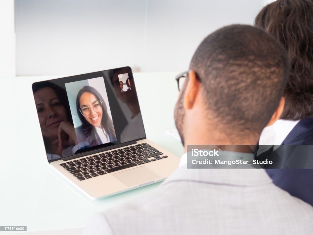 Business people during video chat Business people during video chat. Multiethnic business team having video conversation via laptop. Communication concept Video Call Stock Photo
