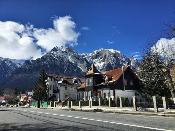 istock Steep mountains tower over a village 1178547273