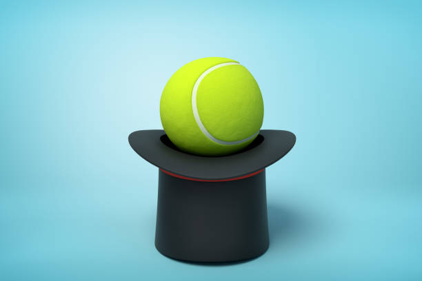 istock 3d rendering of black tophat upside down with tennis ball inside on light-blue background. 1178548008