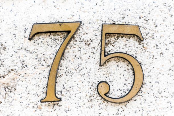 istock House Number 75 on the Building Wall 1178548117