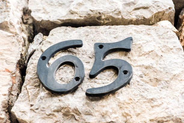 istock House Number 65 on the Building Wall 1178548123