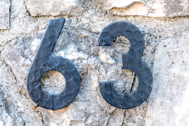 istock House Number 63 on the Building Wall 1178548128