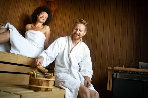 istock Beautiful young couple sitting together in a sauna 1178548145
