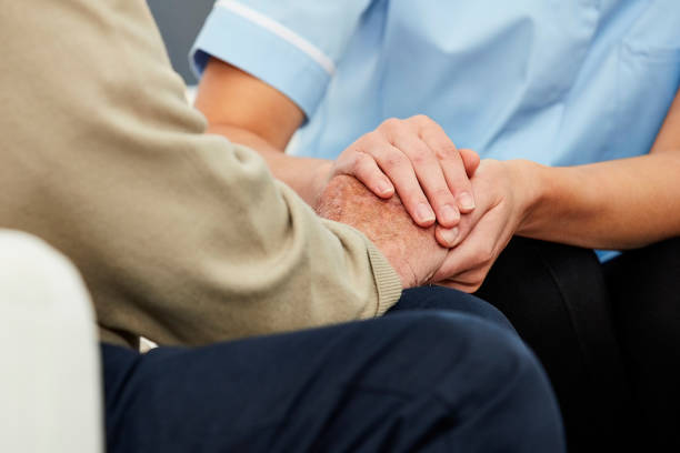 istock Nurse comforting patient 1178548373