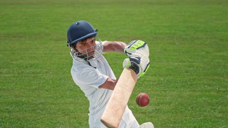 SLO MO SPEED RAMP Male cricket player hitting the ball with his bat