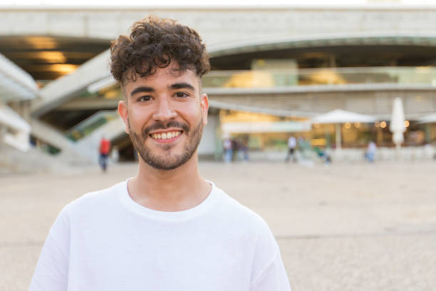 istock Happy carefree guy posing in city square 1178549773