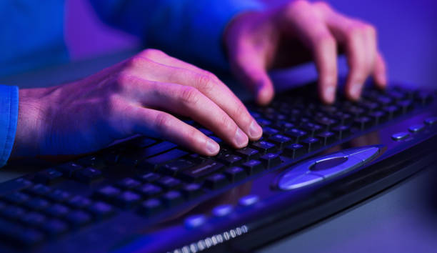 istock Gamer's hands on a keyboard, actively pushing buttons 1178550001