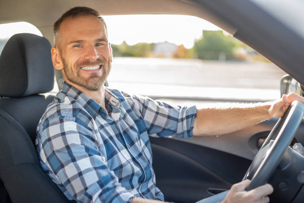 istock Attractive man driving a car. 1178550225