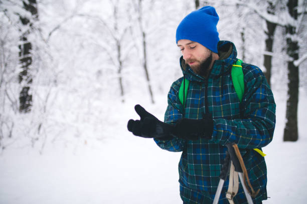 istock Man Traveler walking alone snow mountains. 1178551051
