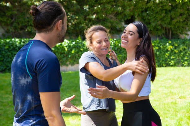istock Friends greeting each other outdoor 1178551475