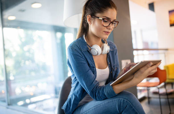 istock Beautiful student girl learning in a library 1178552798